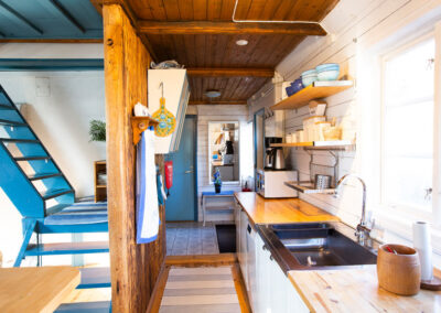 The kitchen and the stairs to the upper floor.