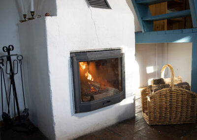 The fire place in the large cottage.